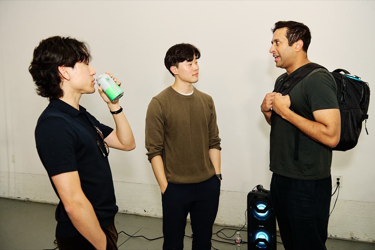 Three attendees having a conversation