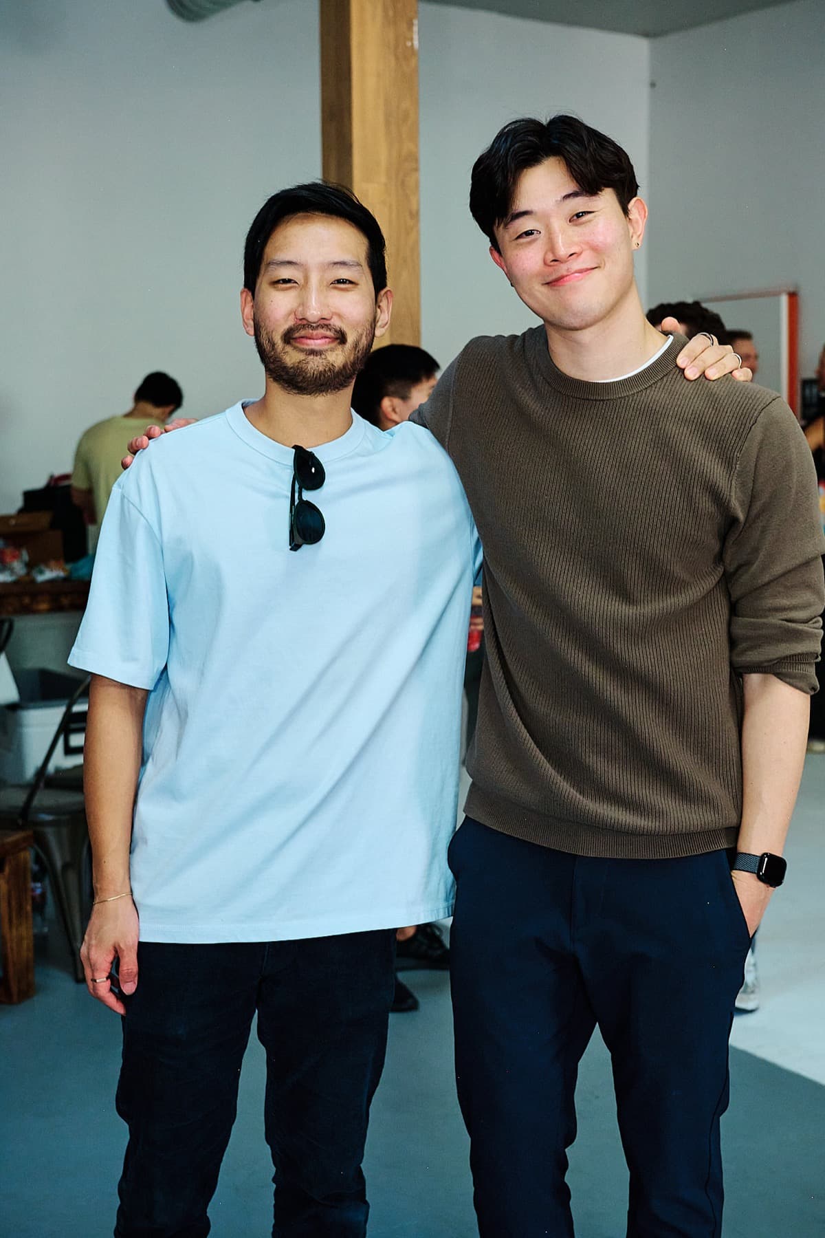 Two friends smiling at the event