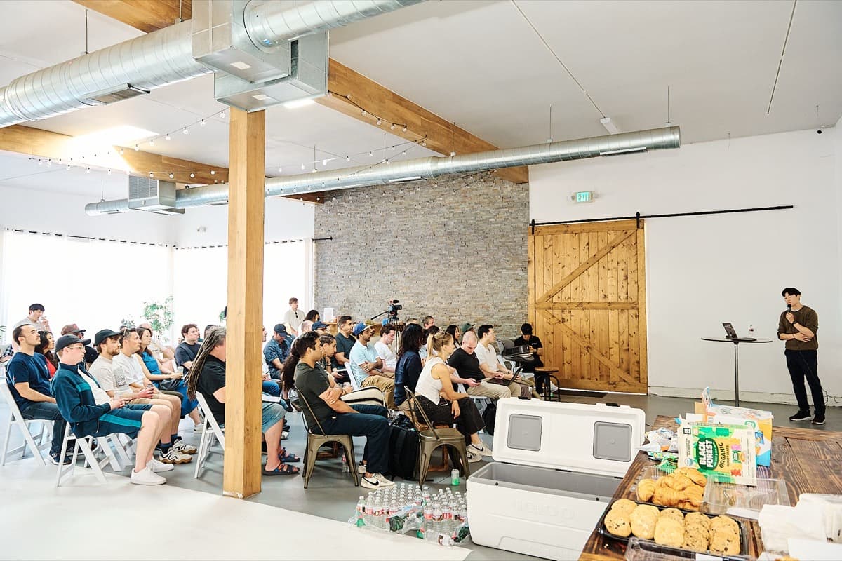 Packed audience watching a presentation