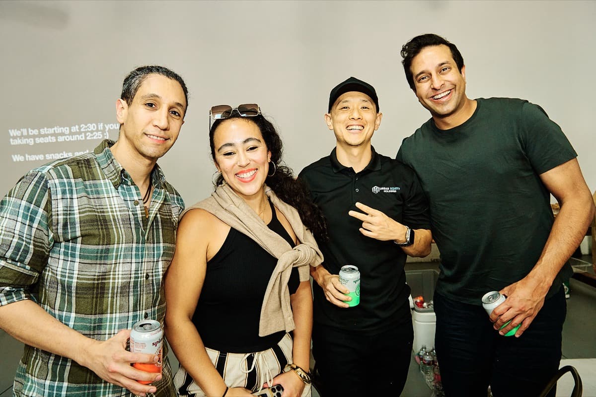 Four friends networking at the meetup